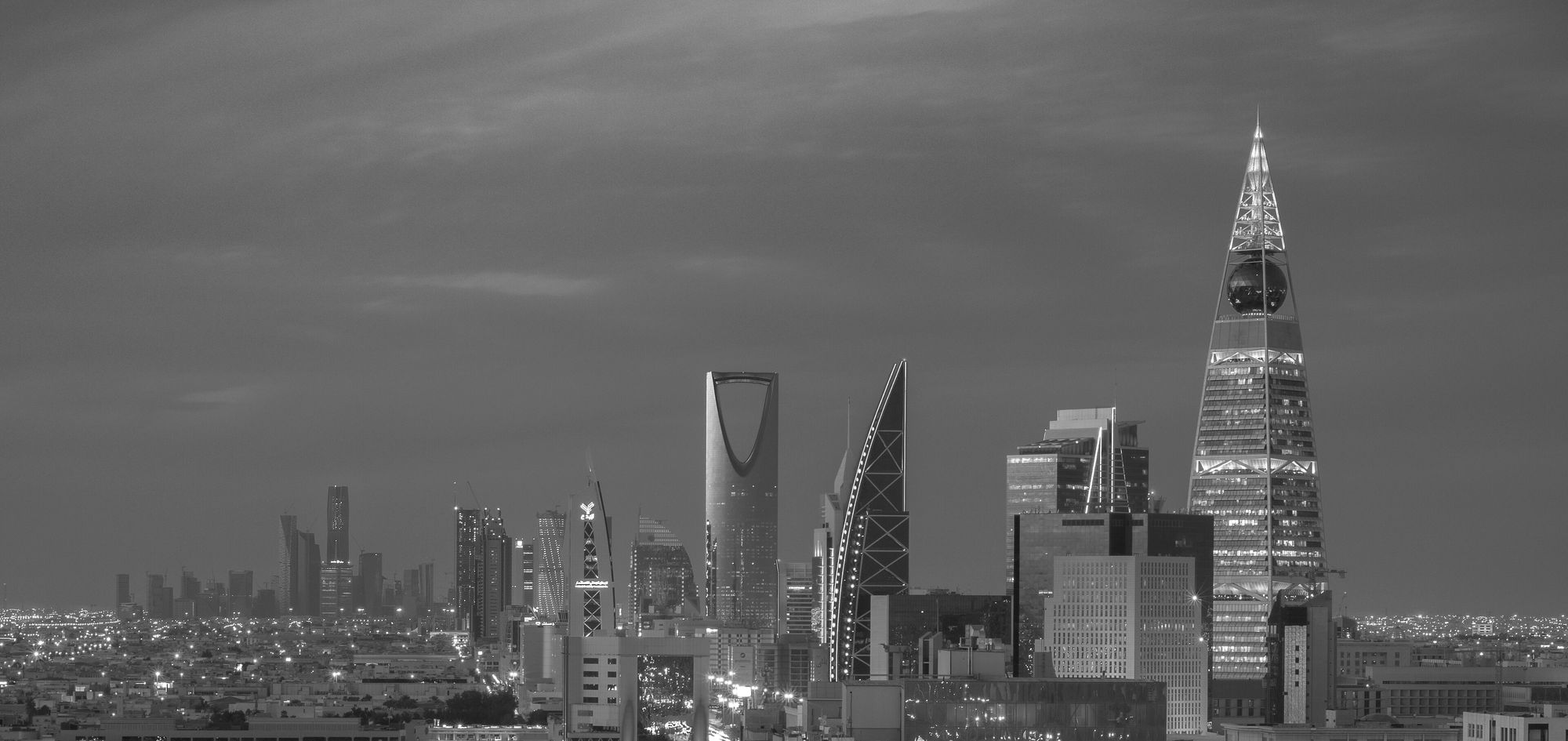 Riyadh's skyline at dusk, with Kingdom Centre and Al Faisaliah among the towers